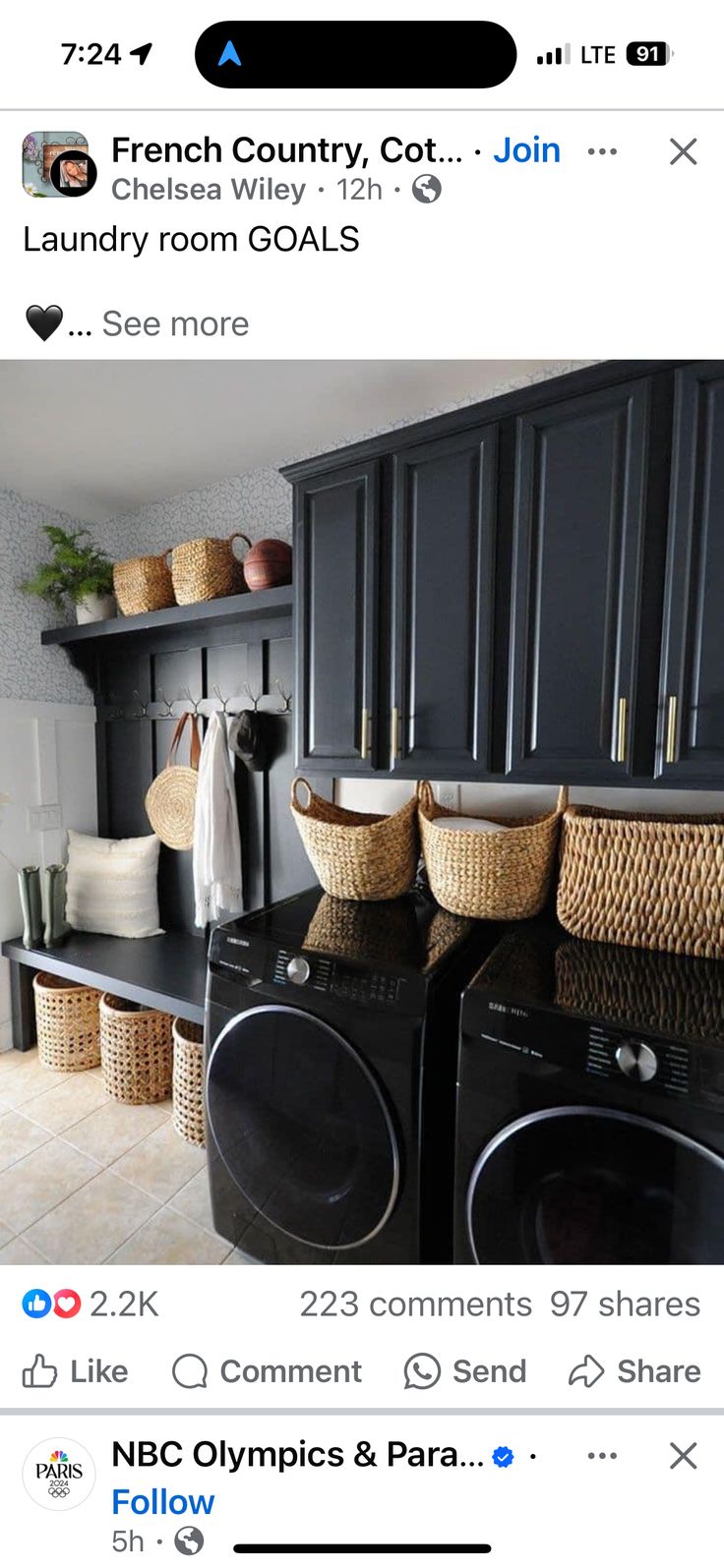 an image of a laundry room with black cabinets and baskets on the top of the washer