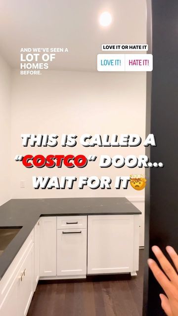 this is called a costco door wait for it sign in a kitchen with white cabinets and black countertops