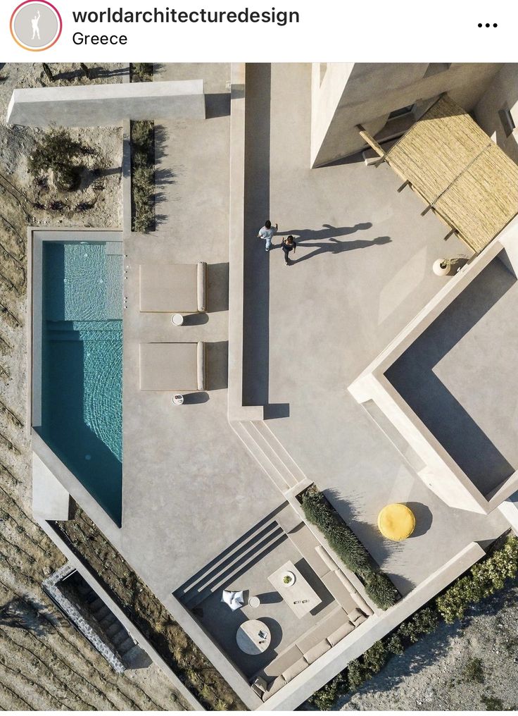 an aerial view of a pool and patio area