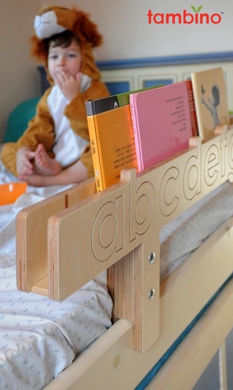 a child's book rack with books on it