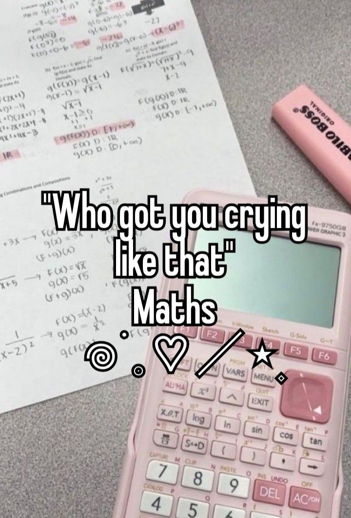 a pink calculator sitting on top of a table next to a pen and paper