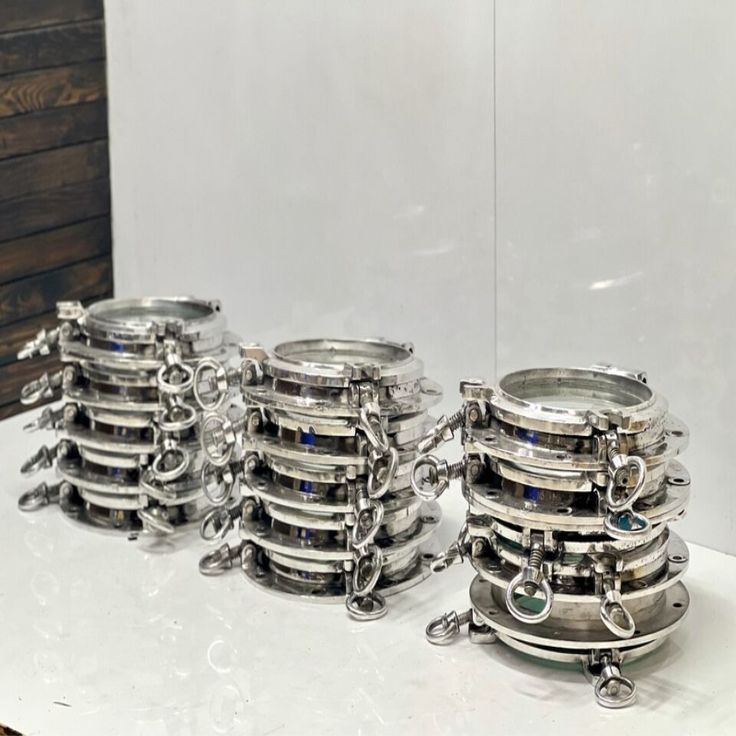 several metal containers stacked on top of each other