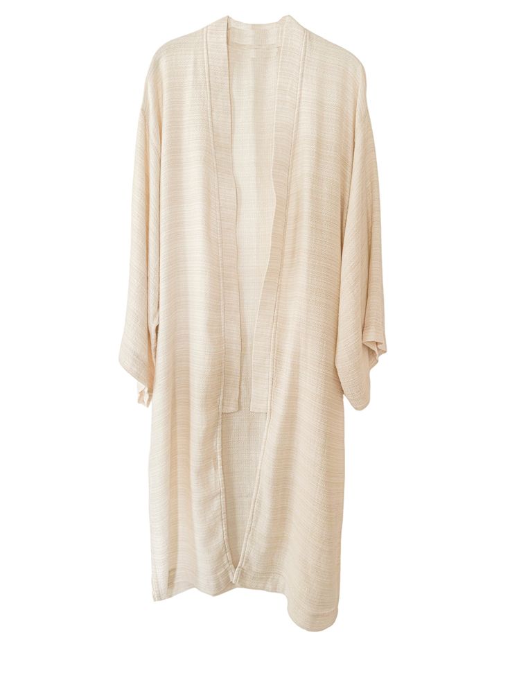 Elevate your lounge wear style with the Ivory Smooth Textured Turkish Cotton Kimono, woven with a beautifully intricate pattern that feels incredibly soft against the skin. Crafted from 100% Turkish Cotton, it ensures both comfort and style for your moments of relaxation at home. Available in one size. Color: Ivory. Material: 100% Cotton. Made in Turkey. Unisex one size. Machine wash delicate. Tumble Dry low. Beige Linen Kimono For Loungewear, Spring Loungewear Kimono With Natural Dye, Spring Cream Robe For Loungewear, Cream Kimono For Spring Loungewear, Spring Cream Kimono For Loungewear, Beige Relaxed Fit Robe For Loungewear, Relaxed Fit Beige Robe For Loungewear, Beige Spring Loungewear Robe, Beige Relaxed Fit Kimono For Loungewear