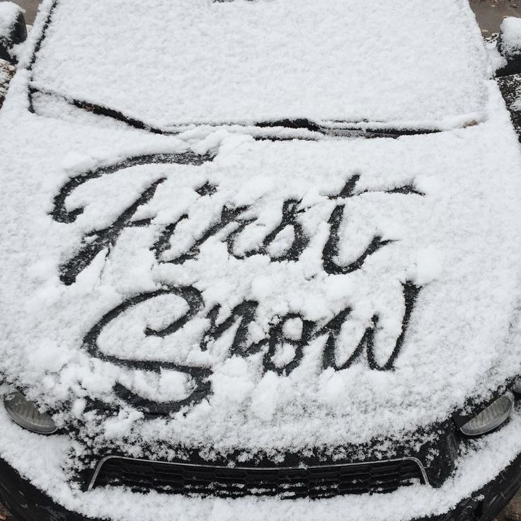 a car covered in snow with the words frost show written on it's windshield