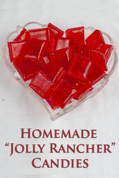 a heart shaped bowl filled with jelly rancher candies