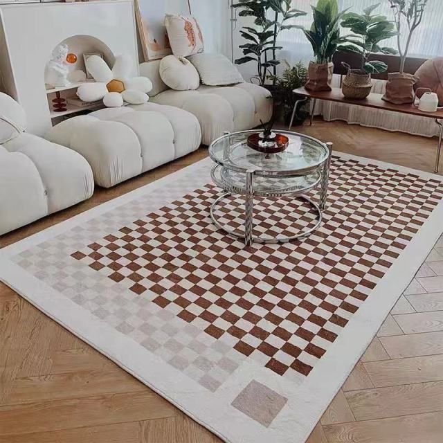 a living room filled with furniture and a checkered rug