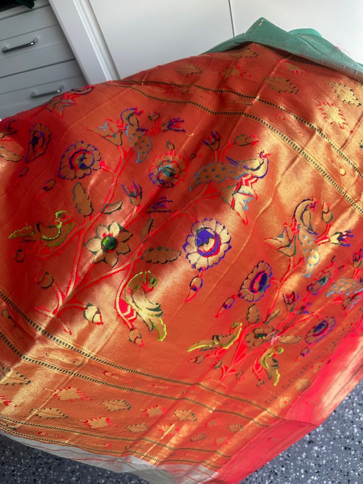 This Muniya border paithani saree from Pure Paithani is an exquisite choice for any special occasion. Its intricate embroidery is skillfully crafted, adding a traditional touch to your wardrobe. It is a perfect way to embody grace and sophistication. fall & pico done blouse size 38-42 Paithani Silk Pre-draped Saree For Traditional Ceremonies, Paithani Silk Embroidered Fabric For Wedding On Eid, Banarasi Silk Dupatta For Puja, Festive Paithani Silk Traditional Wear For Ceremonies, Wedding Embroidered Paithani Silk Fabric For Eid, Wedding And Eid Paithani Silk Embroidered Fabric, Festive Paithani Silk Embroidered Fabric In Traditional Drape, Dola Silk Saree With Embroidered Border For Puja, Paithani Silk Embroidered Fabric For Diwali Ceremonies