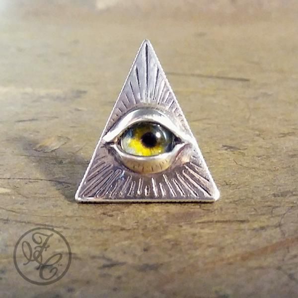 This mysterious Eye of Providence scatter pin features a handmade glass taxidermy eye set in sterling silver. Unique Handmade Collectible Pins, Eye Pin Necklace, Wire Jewelry Eye, Unique Eye-shaped Jewelry For Gifts, Eye Brooch, Victorian Eye Jewelry, Eye Of Providence, Face Painting Tutorials, Wood Resin Jewelry