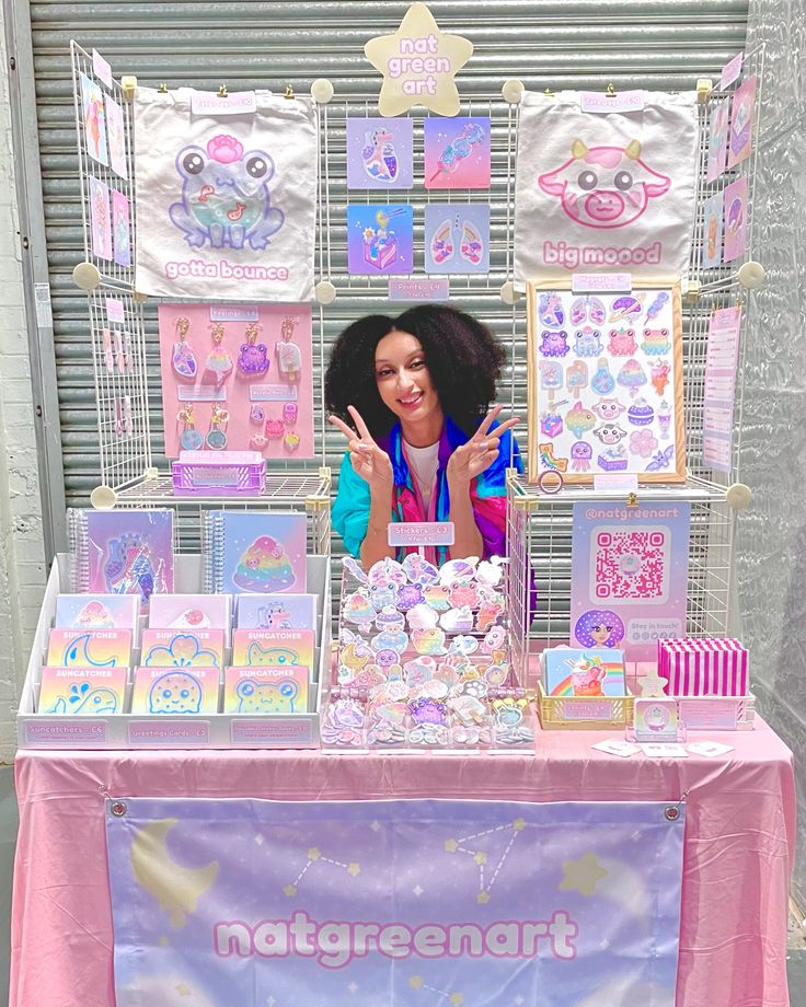 a woman is standing behind a table with many items on it and there are signs that say natremart