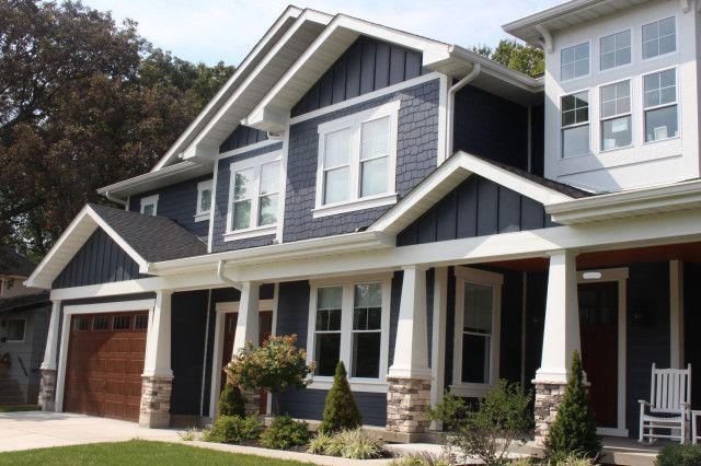 two story house with blue siding and white trim