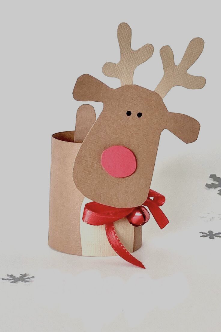 a paper cup with a reindeer head sticking out of it's side and a red ribbon around its neck