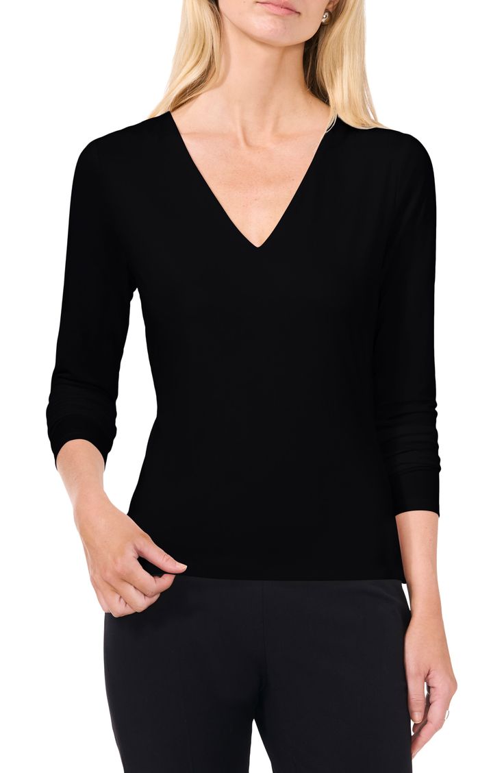 This sleek and classic V-neck top is cut from ultrastretchy body-sculpting fabric that shows off your natural shape. 24" length V-neck Long sleeves 90% polyester, 10% spandex Machine wash, tumble dry Imported Elegant V-neck Top, Solid Top With Smoothing Minimal Stretch, Classic High Stretch Black Top, Fitted Solid Color V-neck Top, Classic Black Tops, Elegant Seamless Stretch Tops, Black Seamless V-neck Top, Elegant Fitted Seamless Top, Elegant Stretch V-neck Top For Fall