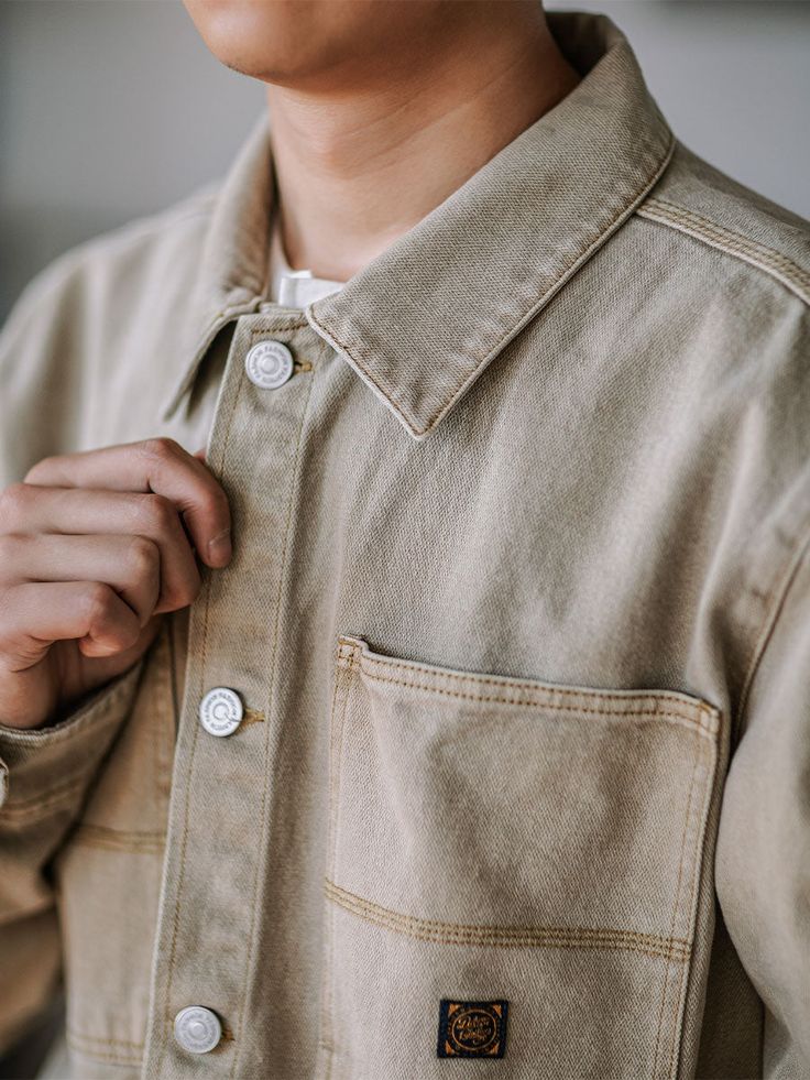 This denim shirt is a year-round essential for your wardrobe. It can be worn alone in the summer or as a layering piece in the colder months. Vintage-inspired work-shirt detailing. Crafted from heavyweight cotton with a straight fit, it is a washed out taupe. FEATURES 100%cotton Straight collar Buttoned placket Two chest pockets. SIZING & FIT Please carefully read the size info before purchase! Different products have different size info.Please use this info as a general guide as measurements ar Brown Cotton Shirt With Patch Pockets, Brown Everyday Collared Shirt, Brown Cotton Utility Top, Everyday Cotton Button-up Denim Jacket, Relaxed Fit Beige Cotton Denim Jacket, Beige Relaxed Fit Cotton Denim Jacket, Everyday Brown Cotton Shirt, Brown Button-up Shirt For Everyday, Brown Button-up Everyday Shirt