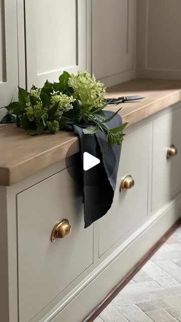 an image of a kitchen setting with flowers on the counter