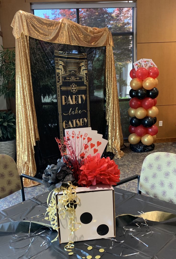 a table with some balloons and decorations on it