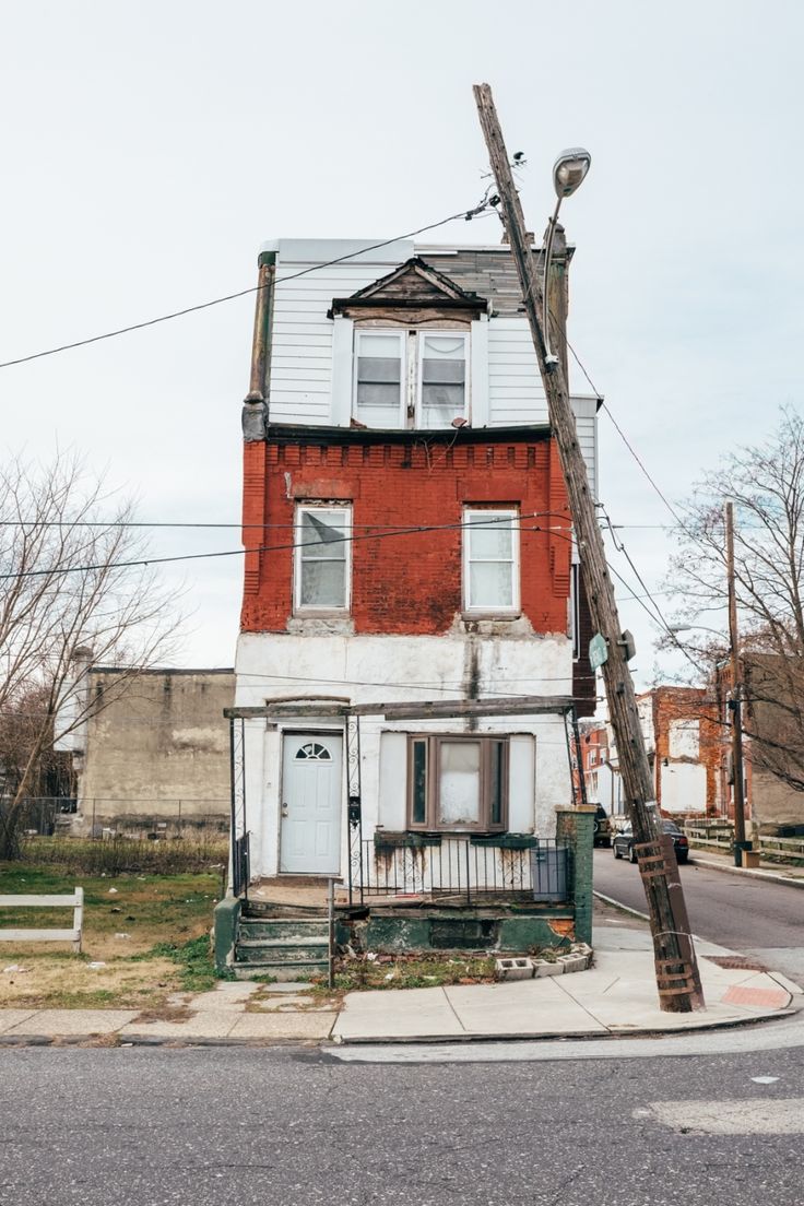 an old house on the corner of a street