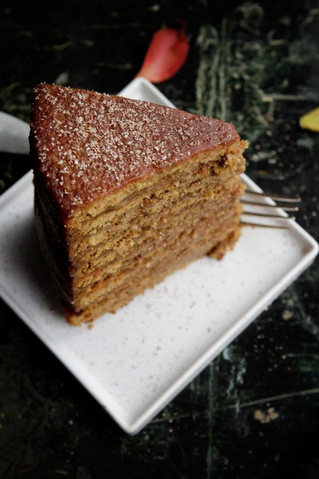 a piece of cake sitting on top of a white plate with a fork in it