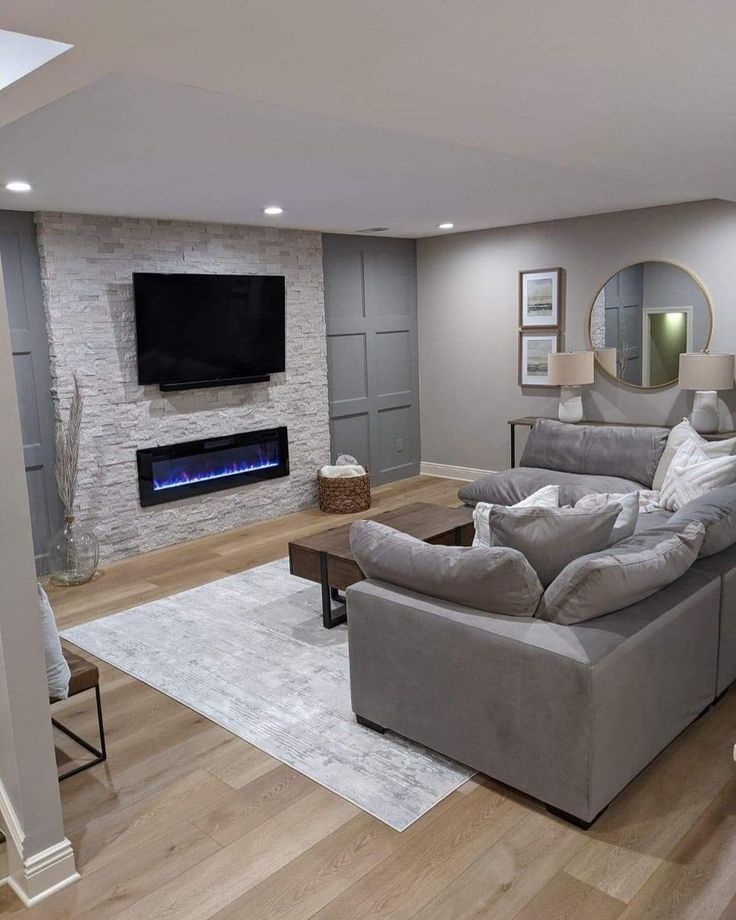 a living room with couches and a fireplace