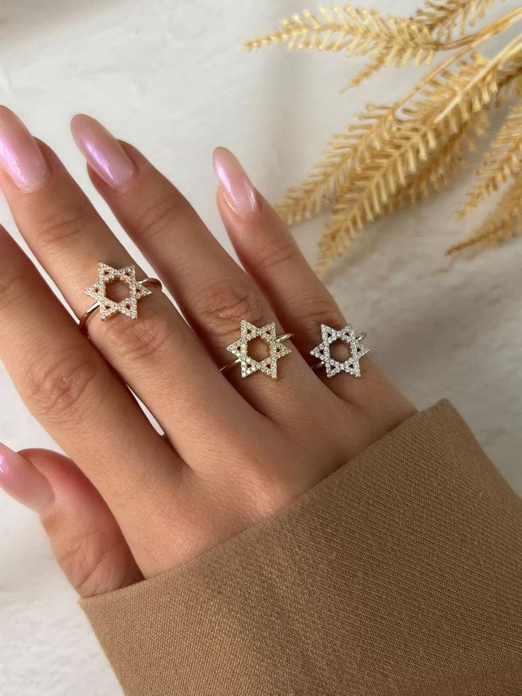 A beautiful Star of David silver ring, coated with yellow/pink gold with zircons. Star Ring For Women, Gold Sparkling Ring As A Gift, Gold Sparkling Sterling Silver Rings, Gold Sterling Silver Ring With Sparkling Detail, Gold Sterling Silver Sparkling Rings, Dainty Sparkling Gold Ring, Elegant Star-shaped Diamond Ring, Sparkle Star Ring, White Gold Star Of David Jewelry Gift