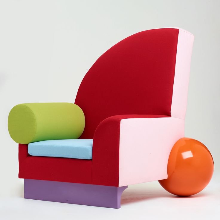 a colorful chair with an orange ball on it