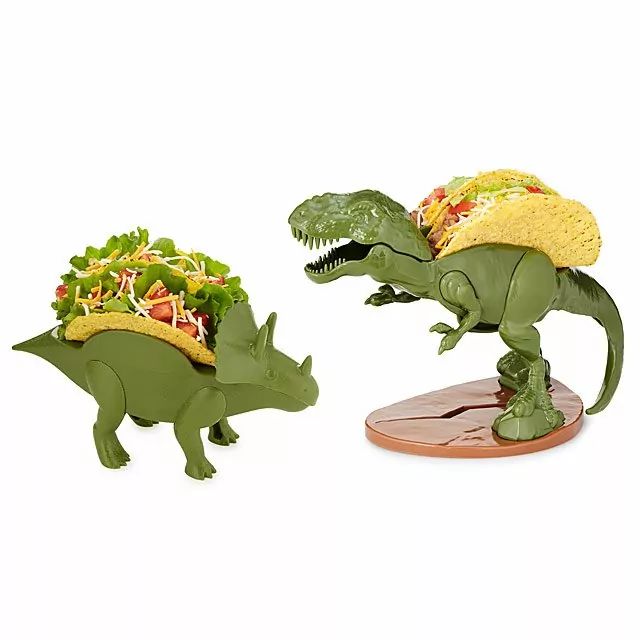 two toy dinosaurs with tacos on their heads