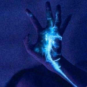 a person's hand with blue light painted on it in the middle of their body