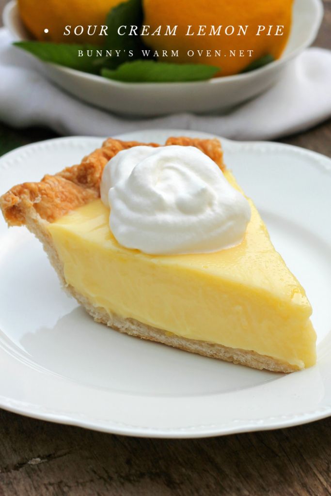 a slice of sour cream lemon pie on a white plate