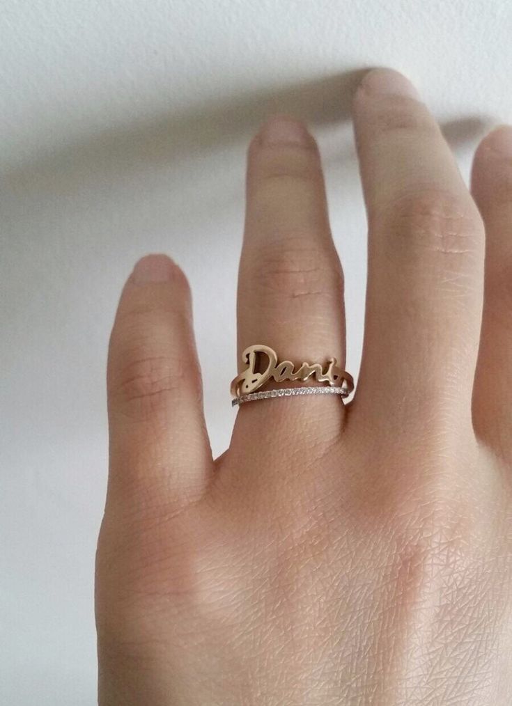 // FREE SHIPPING within U.S. // This 14k solid gold Skinny Name Ring is simply elegant. Gracefully wrap your or your loved ones name around your finger. Available in 14k yellow, white or rose gold. Makes a beautiful modern wedding ring; its simplicity also makes a lovely anniversary ring or push present for stacking with other rings. DETAILS: - First letter measures approximately 7mm - Lowercase letters measure approximately 3.5mm - Bottom shank measures 1.25mm Please write the name of your choi Personalized Diamond Initial Ring For Wedding, Personalized Diamond Initial Ring For Anniversary, Personalized 14k White Gold Initial Ring, Personalized Yellow Gold Diamond Ring In Sterling Silver, Customizable 14k Gold Jewelry For Promise, Customizable 14k Gold Promise Jewelry, Personalized Silver Diamond Ring In 14k Gold, Elegant White Initial Ring For Promise, Luxury Personalized 14k Gold Diamond Ring