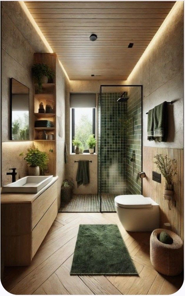 a modern bathroom with wooden floors and green rugs on the floor, along with a walk - in shower