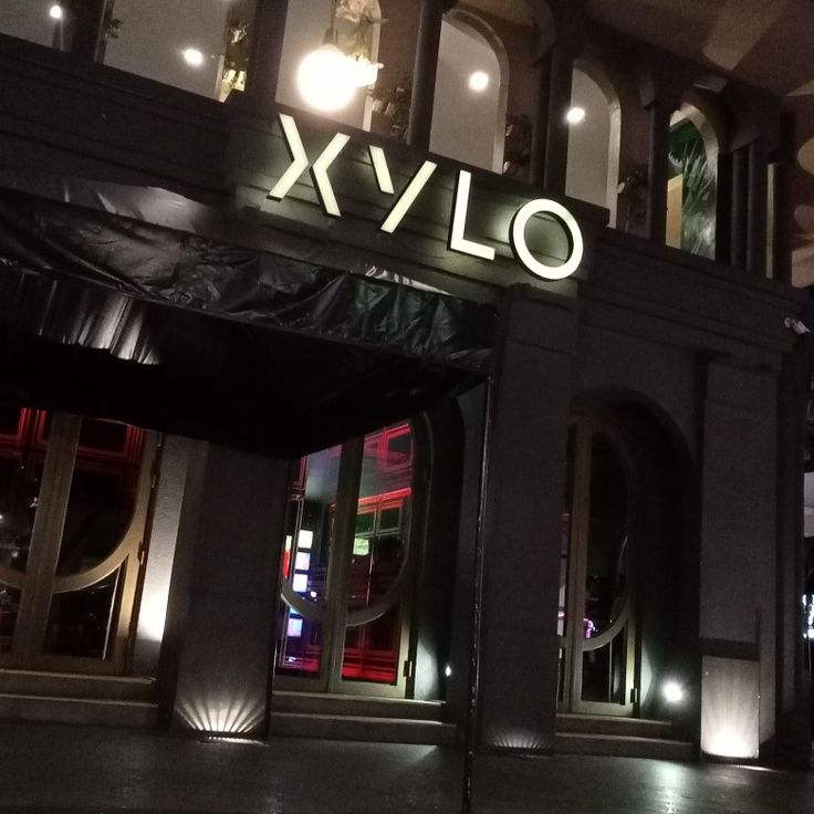 the entrance to xylo is lit up at night