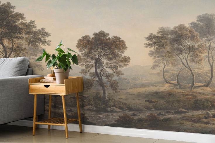 a living room with a couch, table and wallpaper that has a painting on it