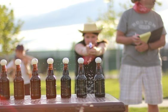 there are many bottles on the picnic table