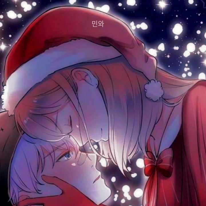 a couple kissing under a christmas tree with snow flakes in the sky behind them