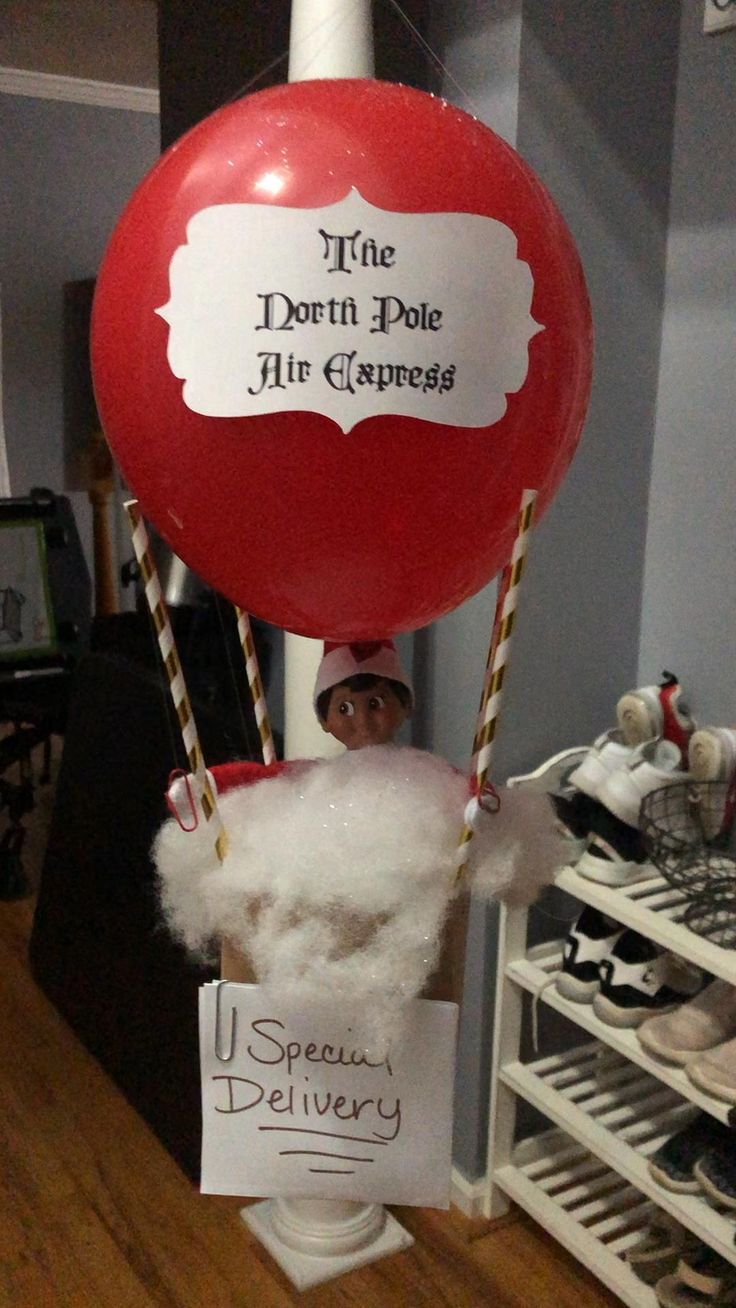 a person wearing a santa hat and holding a red balloon with the words, the donut hole air gapress