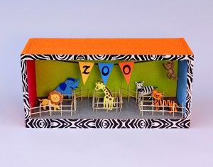 a toy house with animals and flags on it