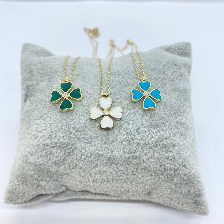 - Four Leaf Clover pendant is made with high-quality 14K solid gold and decorated with a white cubic zirconia stone and green, white and turquoise enamel. -The same model is also listed as a bracelet. The Clover size is 0.51 X 0.51 inches - This dainty, delicate and trendy four leaf clover pendant necklace has been artfully designed for stylish lucky women. - You receive four leaf clover jewelry in a beautiful and free gift box. - Free shipping (Arrive within 4 business days to USA and Canada ( White Flower Pendant Necklace For Birthday Gift, White Flower Pendant Necklace For Birthday, White Heart Pendant Necklace For Birthday Gift, White Clavicle Chain Necklace For Birthday, Gold Necklace For Mother's Day, Luxury White Necklace For Valentine's Day, Gold Necklaces For Valentine's Day, White Heart Pendant Jewelry For Birthday Gift, White Pendant Necklace For Birthday Gift