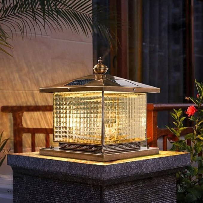 a light that is sitting on top of a table in front of some plants and flowers