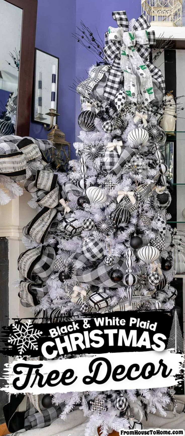 a christmas tree decorated with black and white ribbons