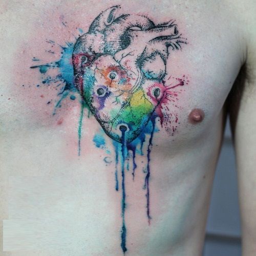 a man's chest with a heart painted on it and watercolor splatters