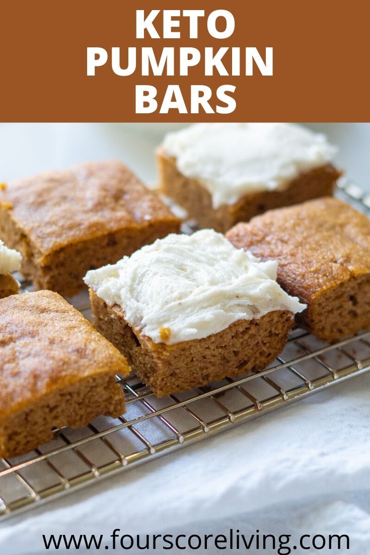 four pieces of pumpkin bars on a cooling rack