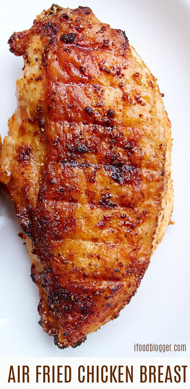 grilled chicken breast on a white plate with text overlay that reads air fried chicken breast