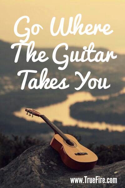 a guitar sitting on top of a rock with the words go where the guitar takes you