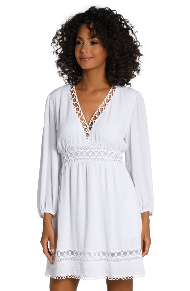 This dress gets its boho-chic vibe from crocheted details, pom-pom trim and casually cool crinkled fabric. Style with a V-neck and breezy bell sleeves, it can be worn as a dress or a cute cover-up that's ready for anything, from pool parties to music festivals. [split] Details V-neck dress Keyhole closure in back Hits above the knee Side pockets Fabric 100% Rayon Crinkle V-neck Beach Dress With Lace Trim, Breezy V-neck Beach Dress For Daywear, V-neck Beach Dress With Lace Trim As Cover-up, Flowy V-neck Cover-up For Brunch, Summer Boho Dress With Lace Trim And V-neck, Summer Boho Dress With V-neck And Lace Trim, Elegant Boho Dress With Lace Trim For Vacation, Chic V-neck Crochet Beach Dress, V-neck Rayon Tunic For Vacation