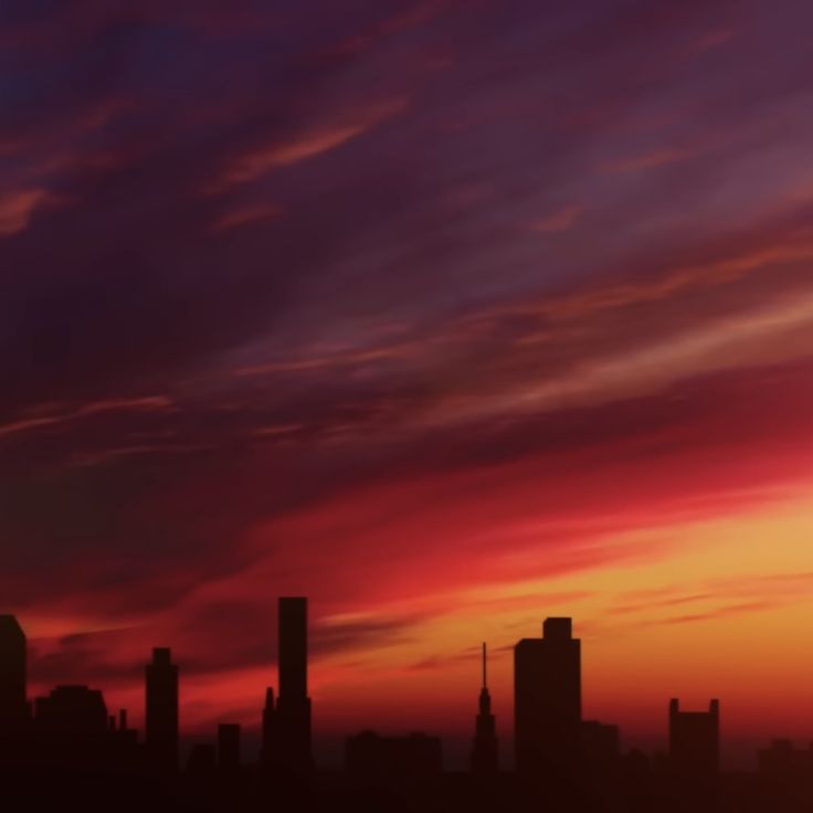 the sun is setting over a cityscape with skyscrapers in the distance and clouds in the sky