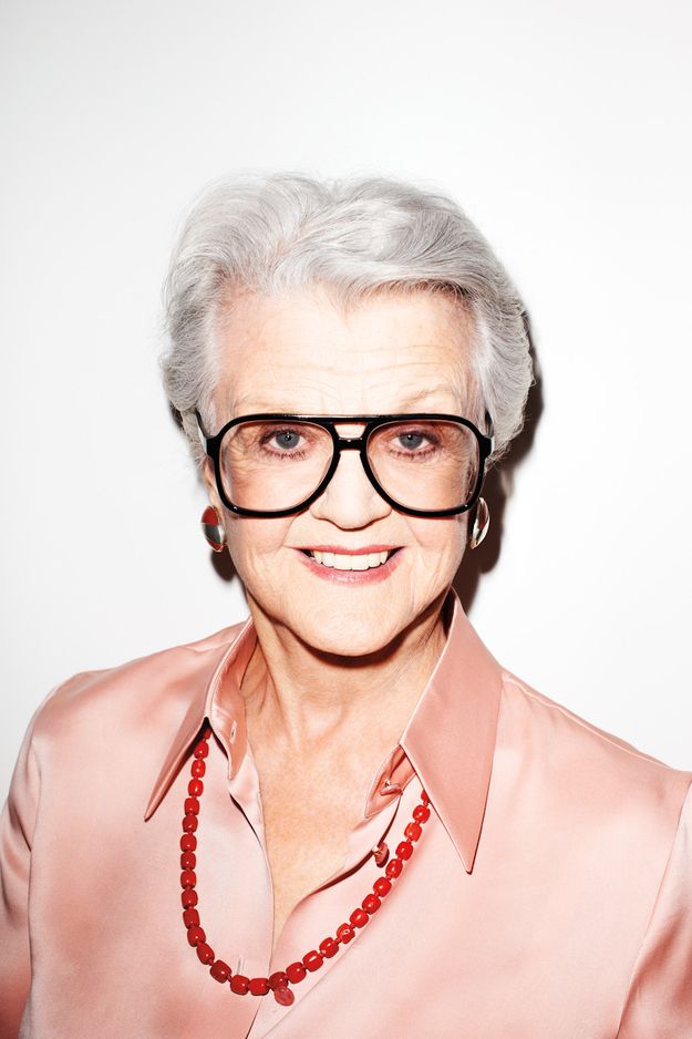 an older woman wearing glasses with the words angeloa lansbbury on her face