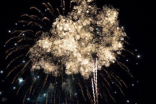 fireworks are lit up in the night sky