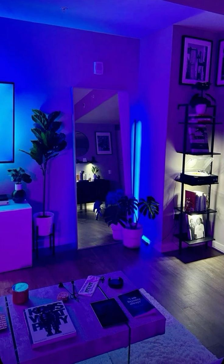 a living room filled with furniture and purple lighting