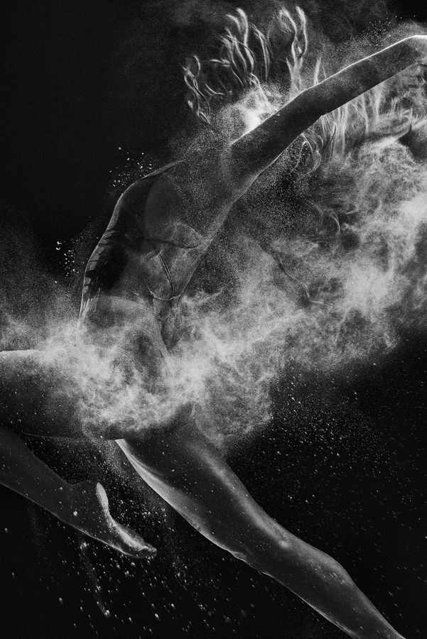 black and white photograph of a woman covered in powder