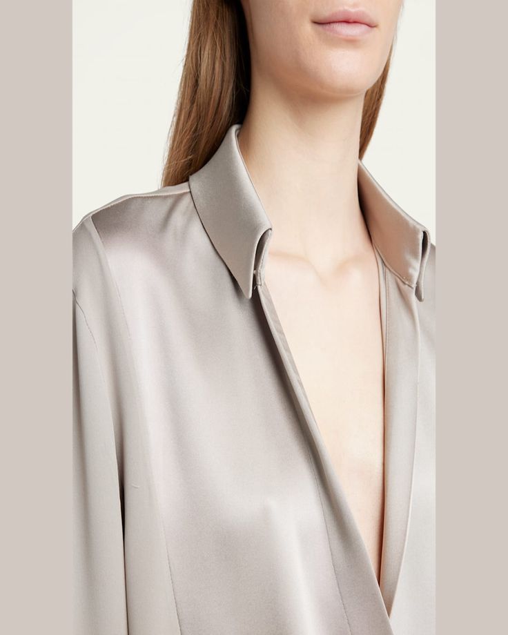 Giorgio Armani silk georgette blouse features a wrap front styling     Vneckline; spread collar     Long sleeves    Back yoke     Midlength     Relaxed fit     Silk    Dry clean    Made in Italy Elegant Semi-formal Tops With Lapel Collar, Designer Silk V-neck Blouse, Classic V-neck Blouse For Daywear, Classic V-neck Blouse For Semi-formal Occasions, Luxury V-neck Top For Spring, Formal Silk V-neck Top, Designer Silk Blouse With Spread Collar, Luxury Collared Tops For Evening, Elegant Silk Tops With Lapel Collar