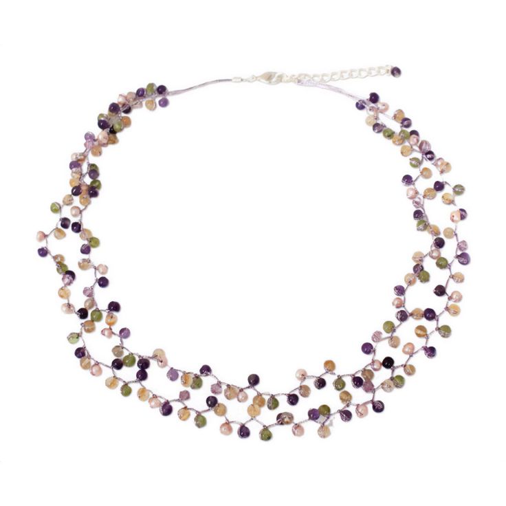 Beautiful gems make up the complexity of this exquisitely beaded necklace. Anusara knots the gems with light purple silk threads, strategically adding cream pearls and glass beads to create a fascinating effect. The necklace features a sterling silver plated brass clasp and extender chain. Adjustable Beaded Purple Pearl Necklace, Adjustable Purple Beaded Pearl Necklace, Elegant Multi-strand Purple Beaded Necklaces, Elegant Adjustable Crystal Necklace With Colorful Beads, Elegant Purple Multi-strand Beaded Necklaces, Multicolor Adjustable Amethyst Necklace, Elegant Lavender Crystal Necklace With Round Beads, Adjustable Purple Pearl Necklace With Round Beads, Purple Pearl Jewelry With Gemstone Beads